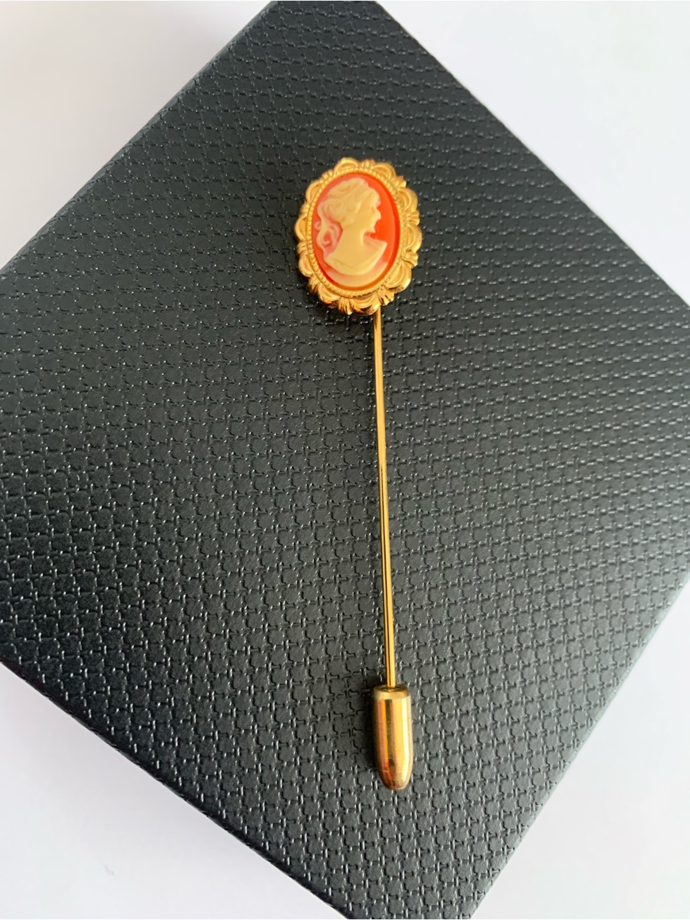 Vintage gold tone cameo stick pin.